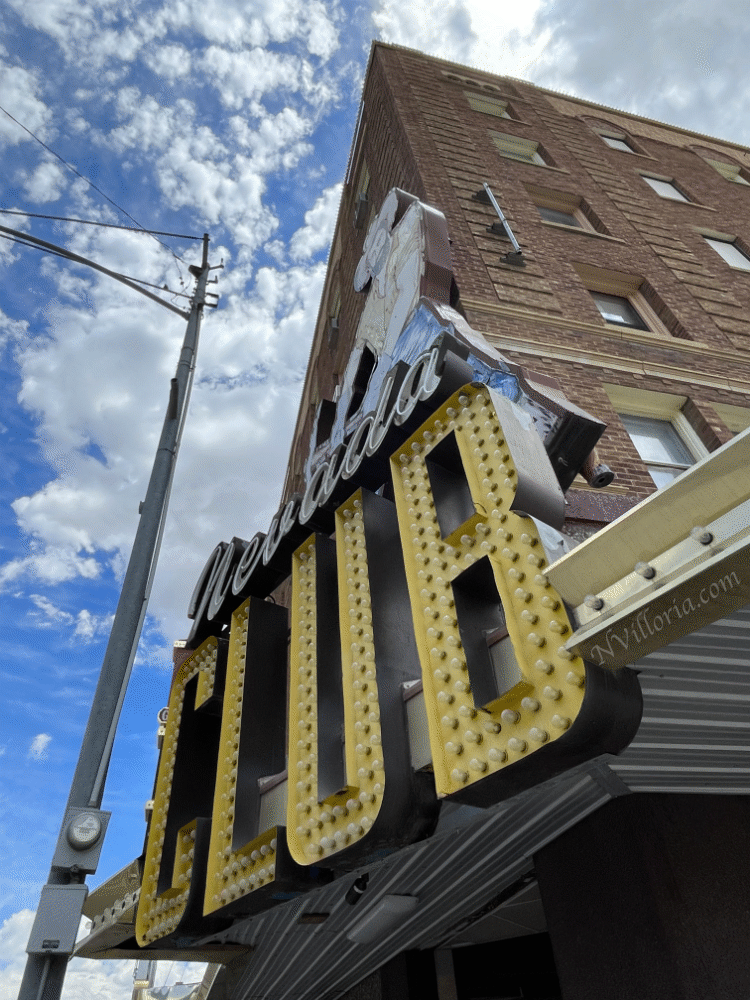 Views from the sidewalk of the exterior of a brick building in Ely, Nevada - via NVilloria.com