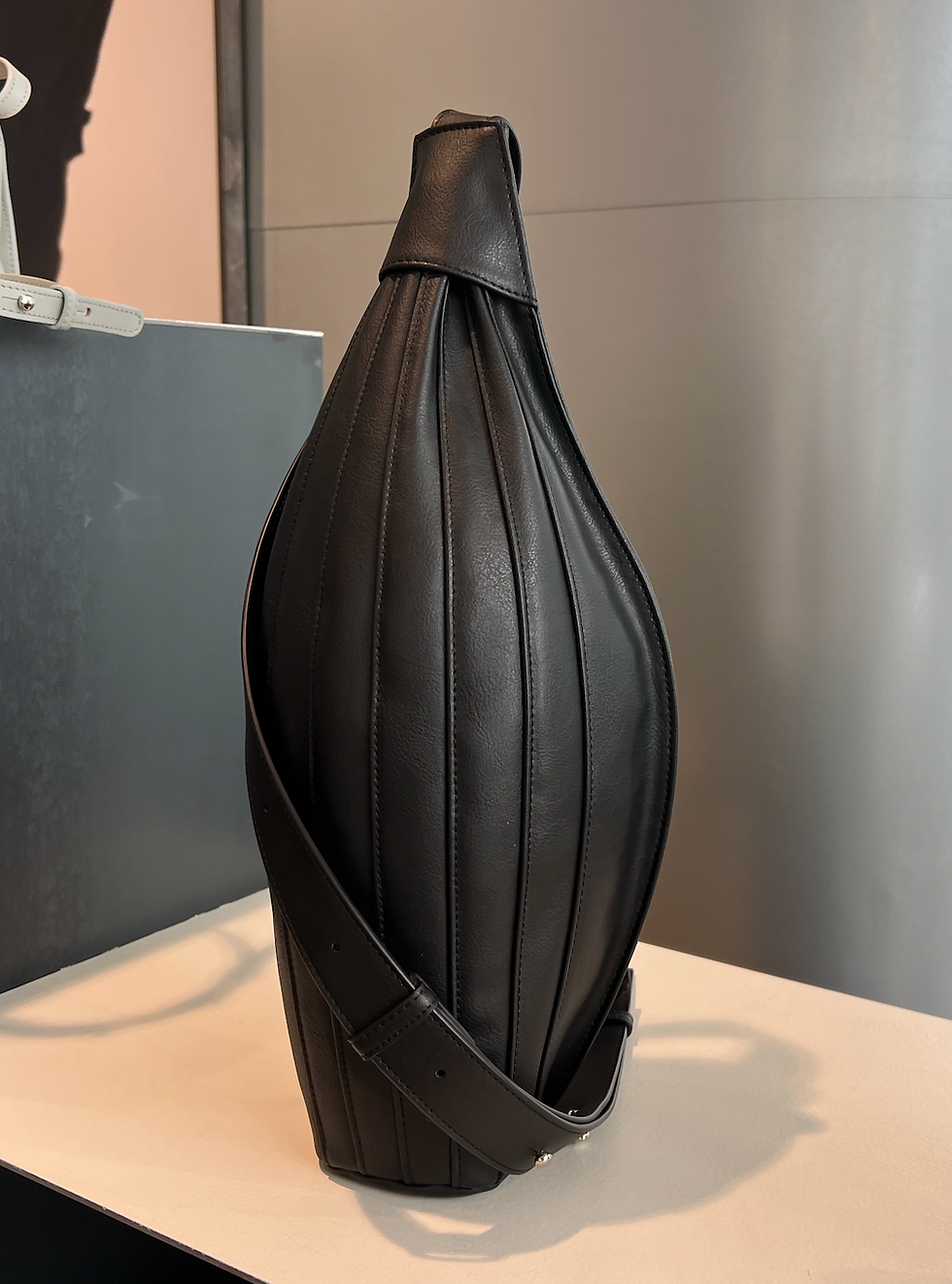 Made from not only vegan grape leather, but also kind of shaped like a wine bag
