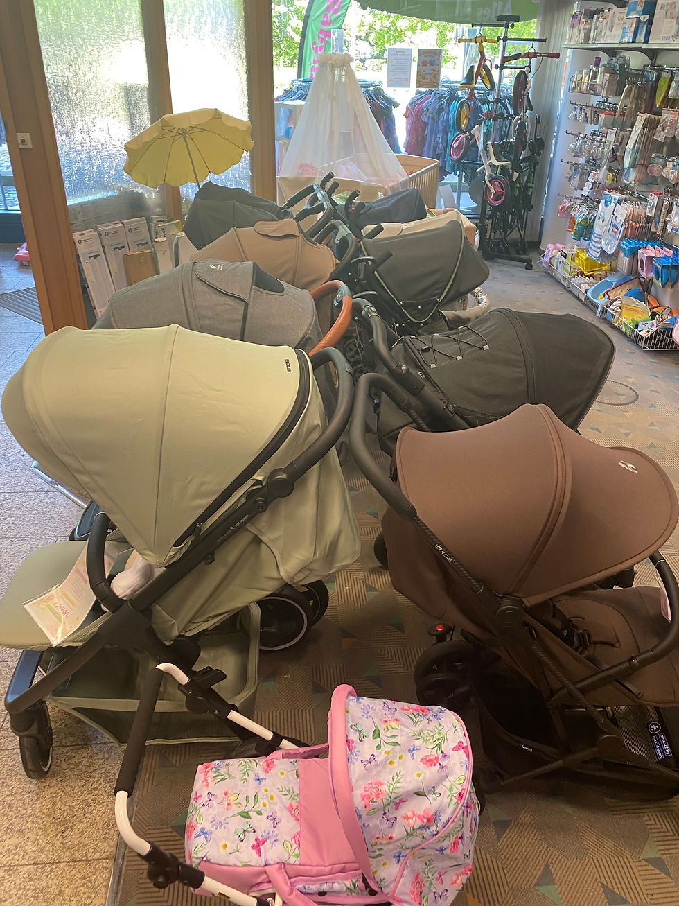 Close-up view of a modern baby stroller displayed in a baby store