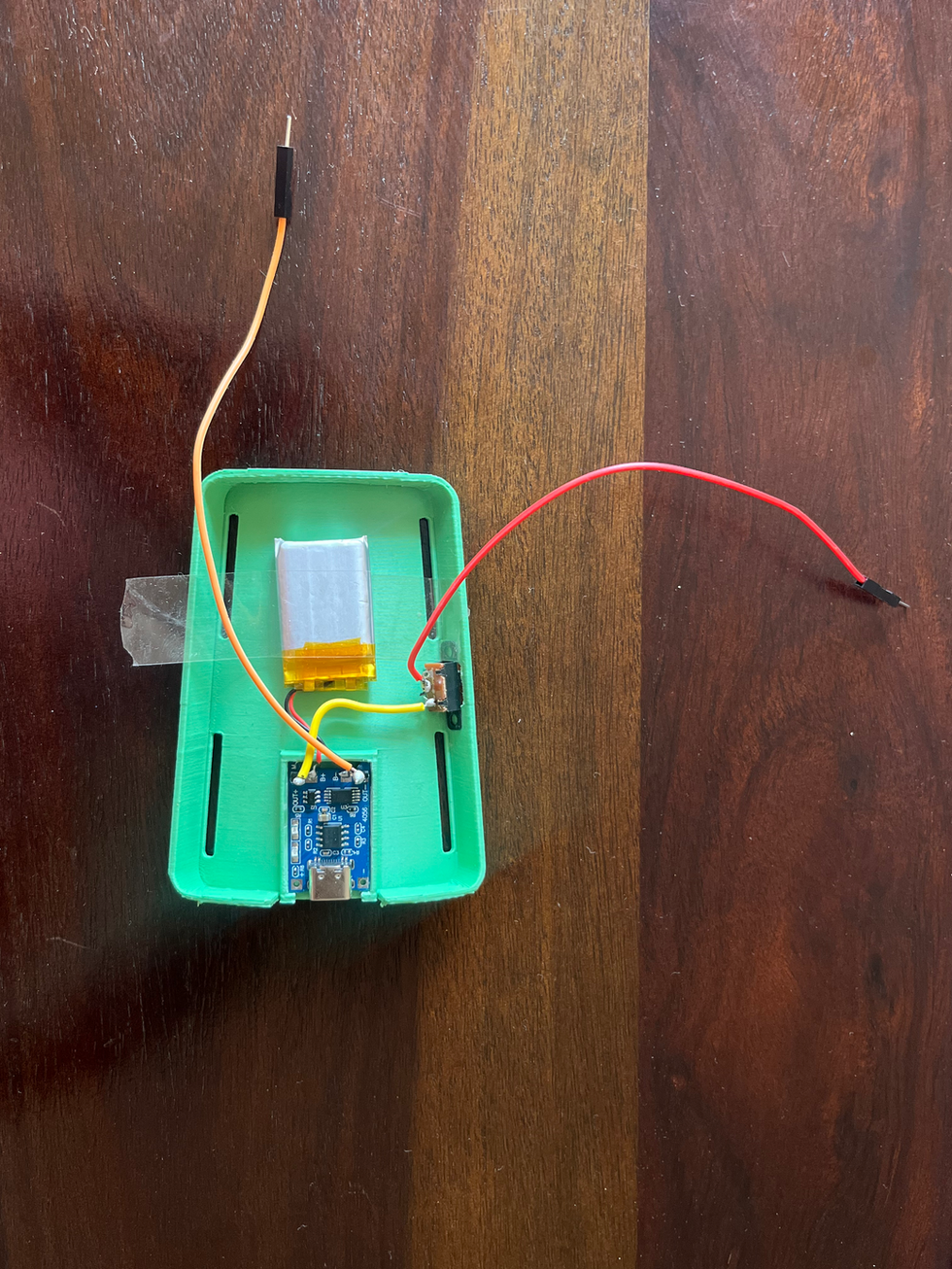 a green box with a battery inside of it