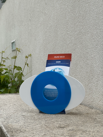 Final acrylic eye‑inspired flyer display model showing front view of abstract eye motif for product design portfolio.