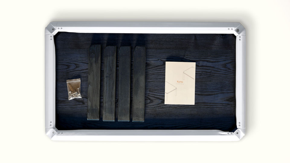 Flat lay of parts and materials organised for a prototype build, showing structured product development and making process.