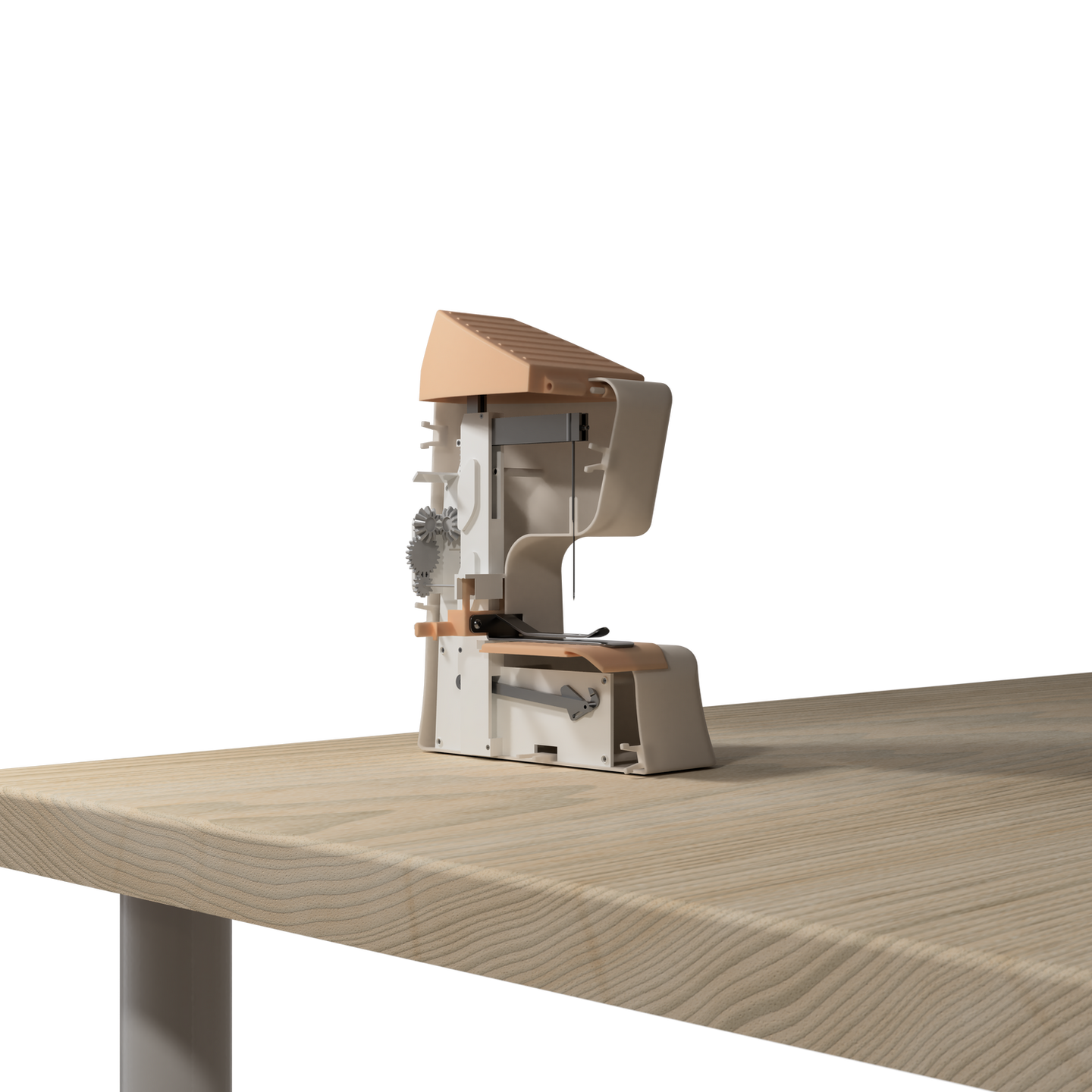 a model of a sewing machine sits on a wooden table