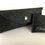 Thumbnail: Closeup image of a charcoal color wool travel case for an extendable metal travel straw
