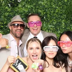 Group of people having fun at an event with props and colorful sunglasses – DJ Dan Fudim, NYC DJ off