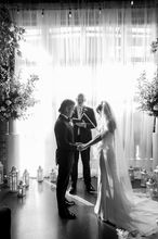 “Bride and groom exchanging vows during an elegant indoor wedding ceremony, with music and entertainment provided by DJ Dan Fudim, a NY wedding DJ offering professional DJ services across NYC, CT, and the Hudson Valley.”