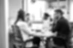 The team sat around a table at PRonto Marketing, discussing a client-centric focus for their digital marketing campaigns