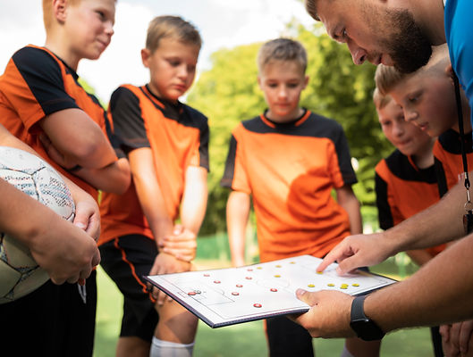 football-trainer-teaching-his-pupils_edited.jpg
