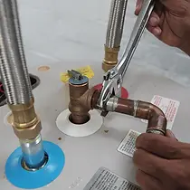 ht-install-an-electric-water-heater-removal-removedischargepipe.webp