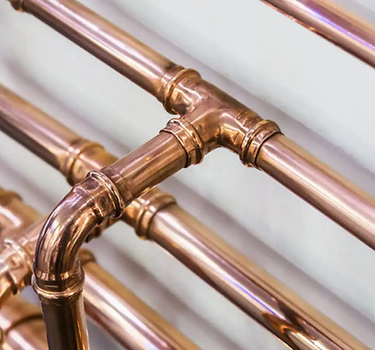Stack of new copper plumbing pipes for repiping projects