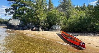 Canoe paddling South Creek with panoramic Adirondack views and sandy beaches, NY