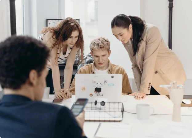 developer team working together at monitor