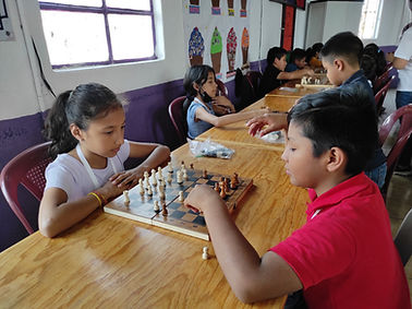 teaching children to play chess and board games in guatemala