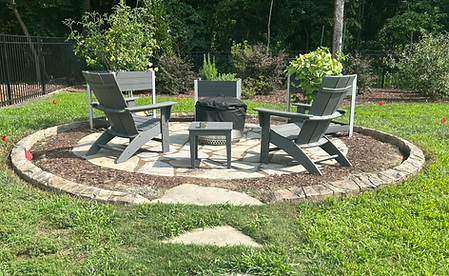 Natural stone curbing around fire pit patio