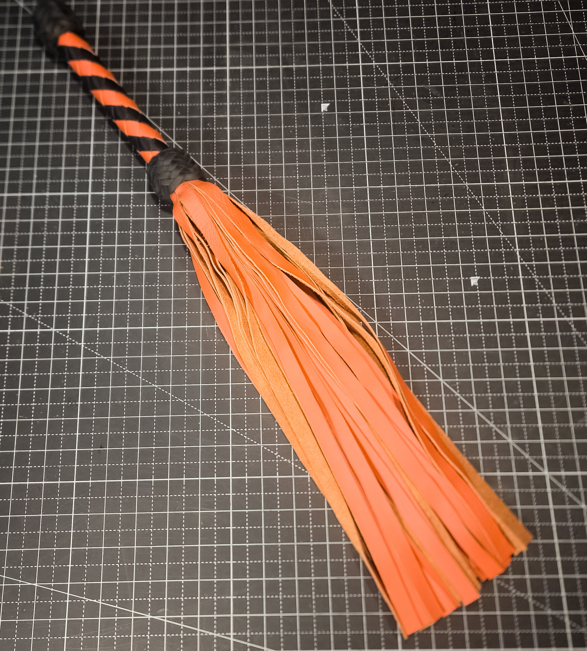 Orange Spiral Handle Leather Flogger
