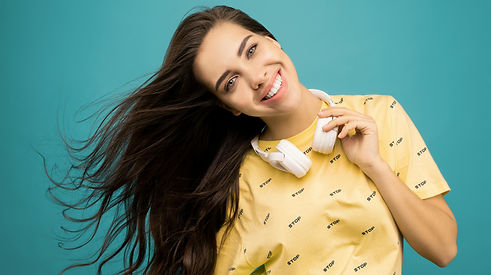 woman with headphones_turquoise bg.jpg