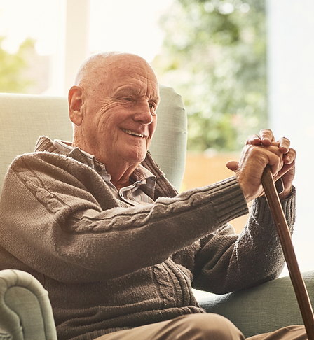 Smiling senior sitting at home.