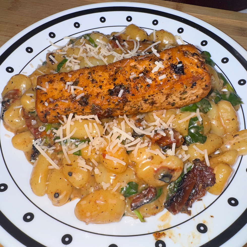 Creamy Tuscan Salmon Gnocchi Recipe, New School Foods Salmon, Parmesan Cheese, Spinach, Sun-dried Tomatoes, Heavy Cream, Gnocchi, White Wine, Butter Garlic Cloves, Salt, Pepper, Italian Seasoning