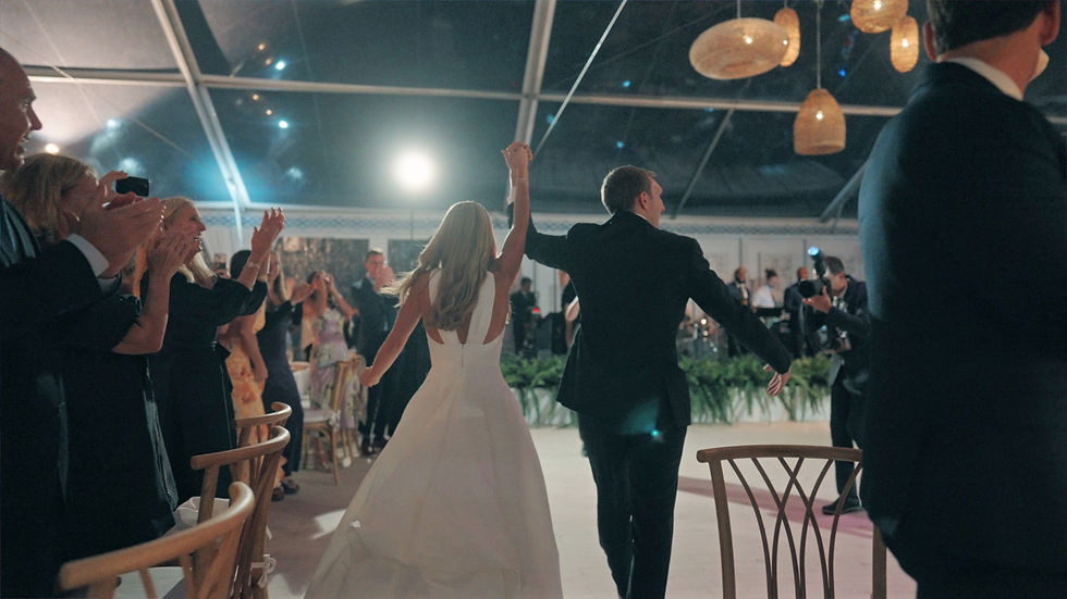 bride and groom enter the reception venue