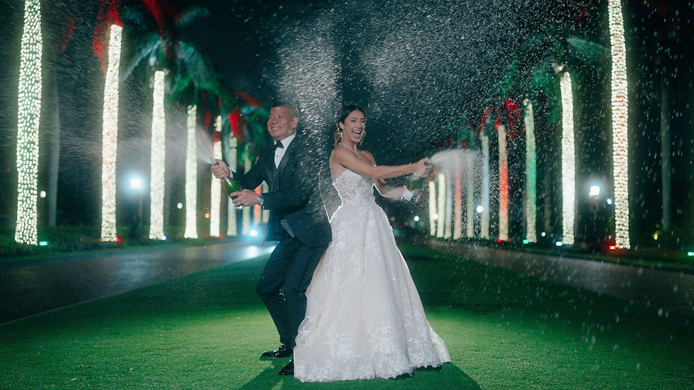 bride and groom pop champagne