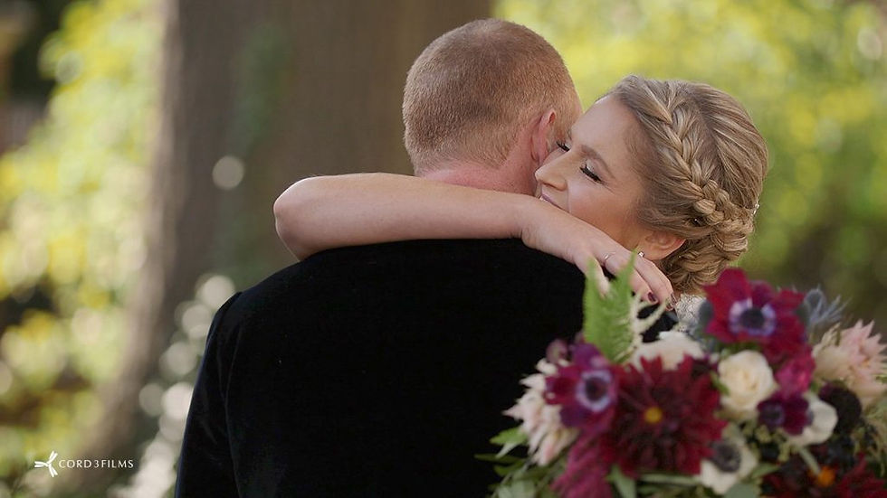 bride and groom hugging outside on their wedding day