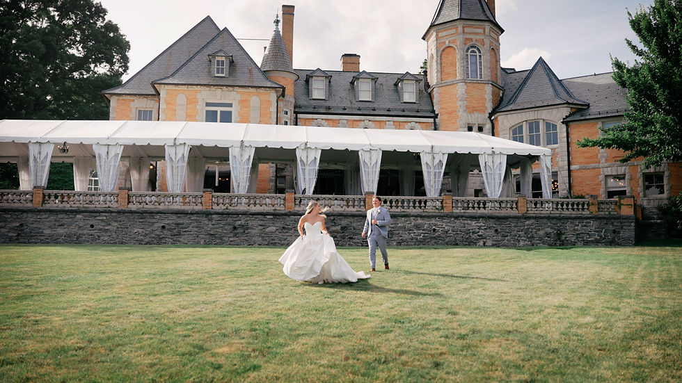 bride and groom walk outside on the estate lawn
