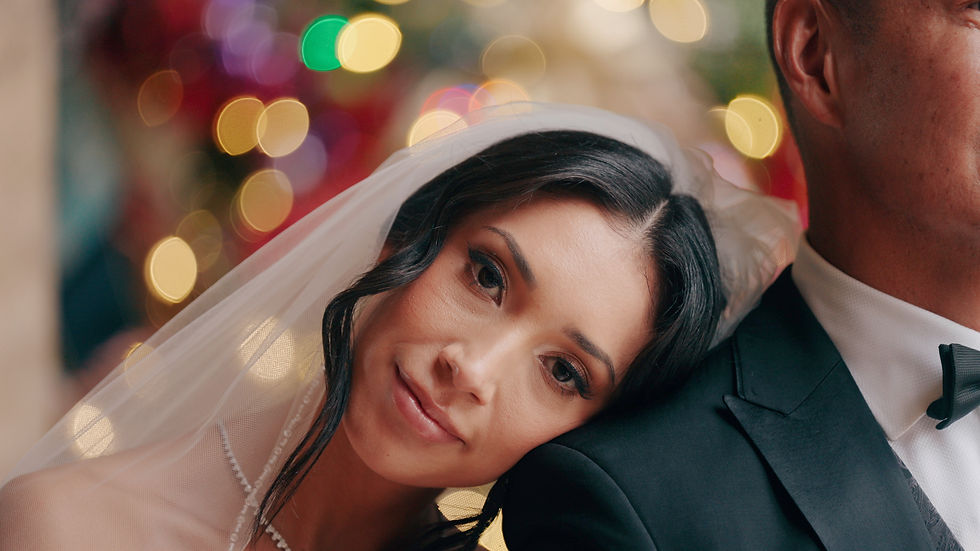 bride with head on her groom's shoulder