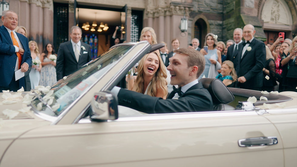 bride and groom leave church via vintage car