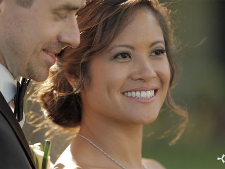 bride and groom smile