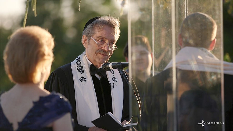 Rabbi at a couple's wedding ceremony