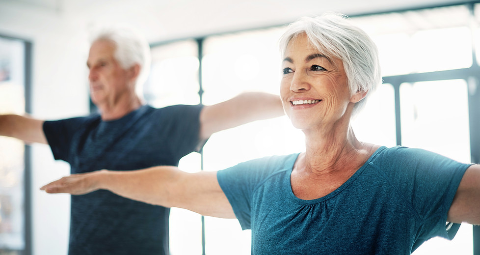 Elderly Couple Practising Yoga