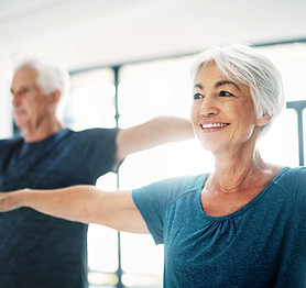 Elderly Couple Practising Yoga