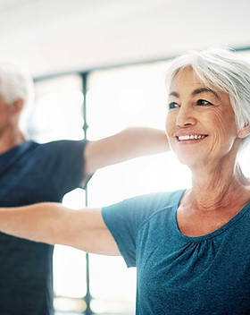Elderly Couple Practising Yoga