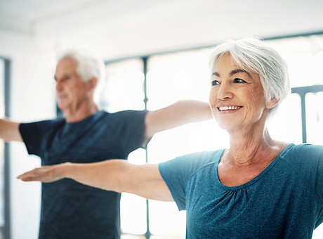 Elderly Couple Practising Yoga