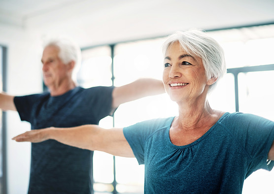 Elderly Couple Practising Yoga