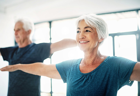 Elderly Couple Practising Yoga