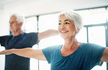 Elderly Couple Practising Yoga