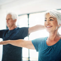 Elderly Couple Practising Yoga