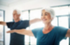 Elderly Couple Practising Yoga