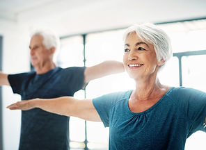 Older couples practicing yoga