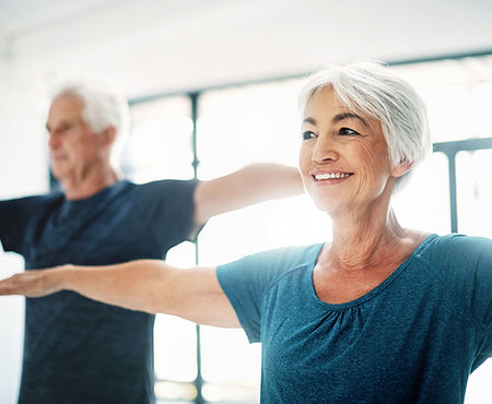 Aging adults doing yoga