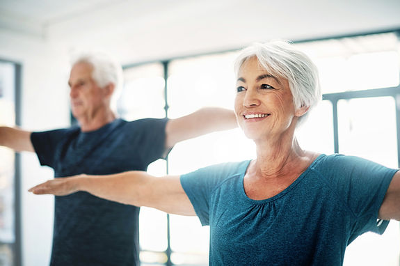 Elderly Couple Practising Yoga