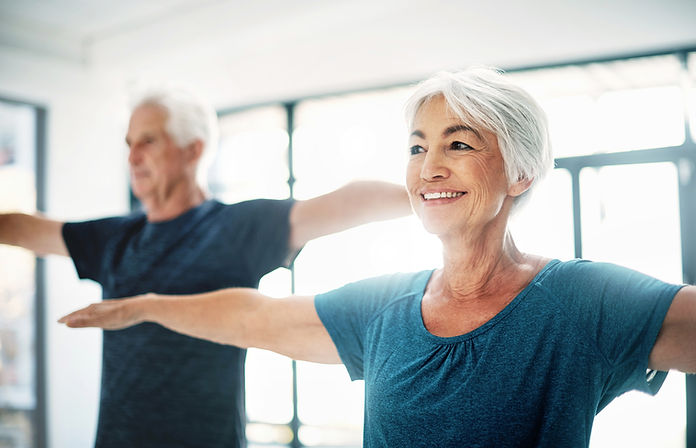 Elderly Couple Practising Yoga