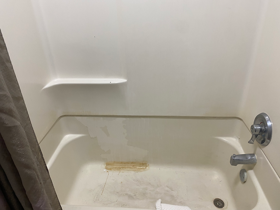 The infamous motel bathtub from our worst travel night, proving that not all vacations go as planned.