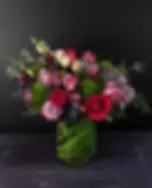 Elegant Valentine’s Day flowers featuring mixed roses and greenery in a clear glass vase, Paragould AR by bloombudz.