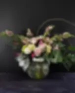 Luxury romantic flower arrangement in soft blush and neutral tones, designed in a textured vase by bloombudz.