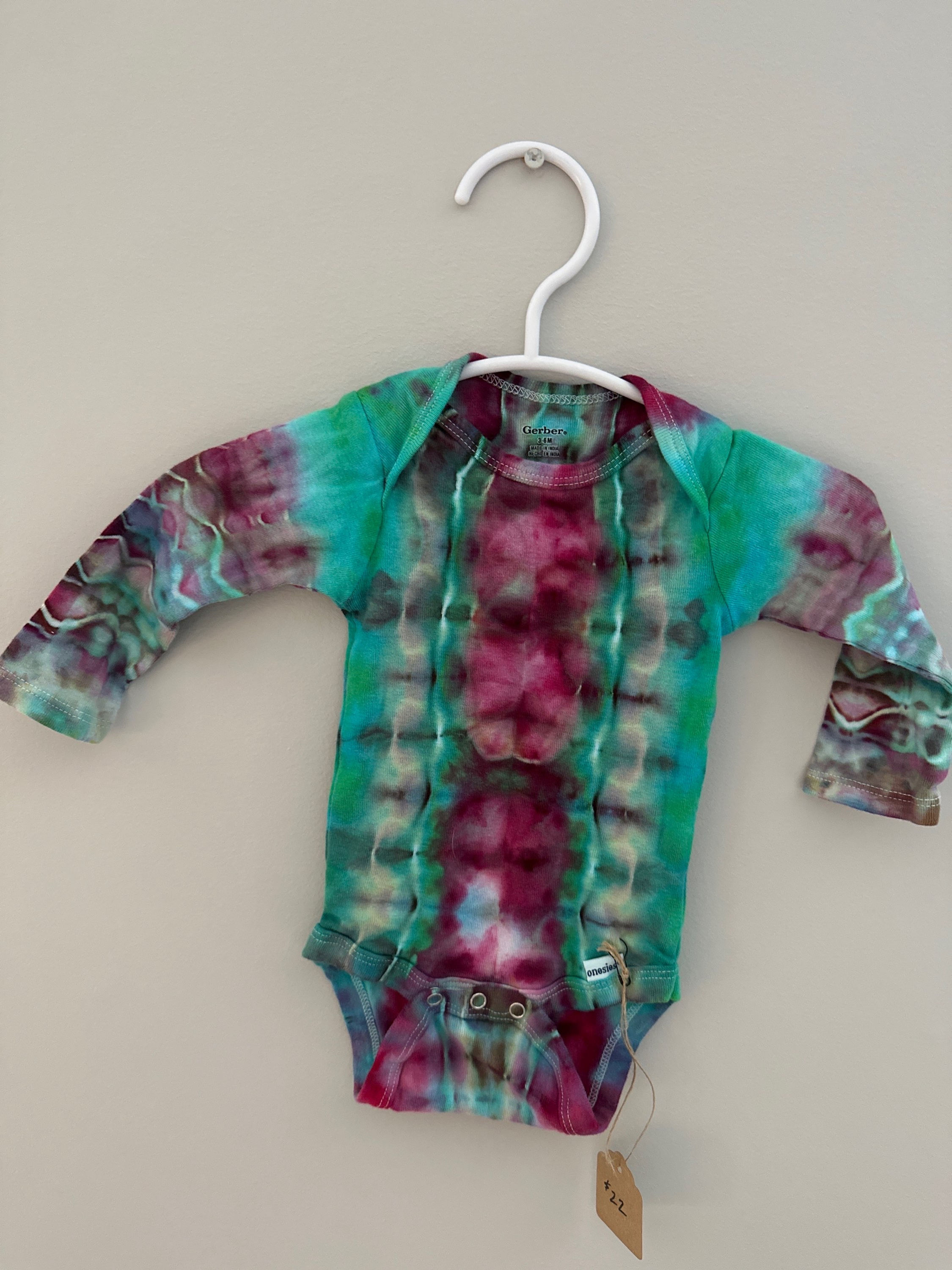 Pink belly green onesie