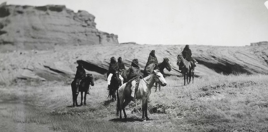 Six Navajo on Horseback