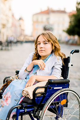 A portrait of a woman in a wheelchair.