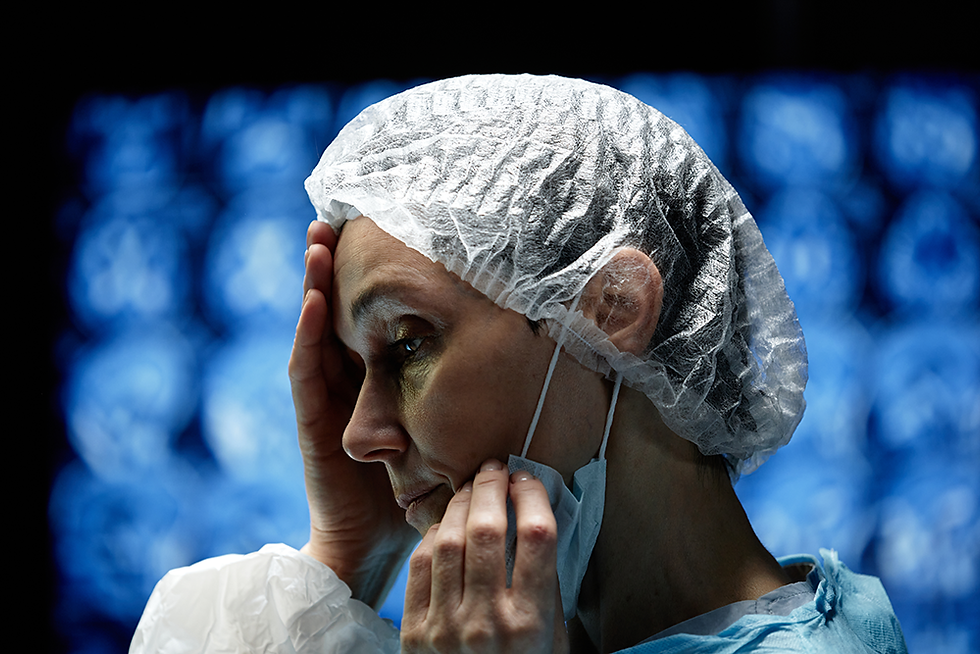 A tired nurse regretting her decisions.